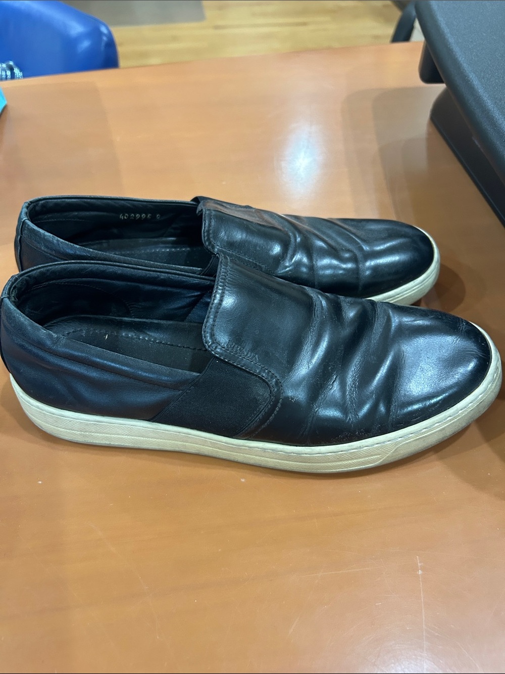 Prada Black Leather Slip-On Sneakers with Off-White Sole